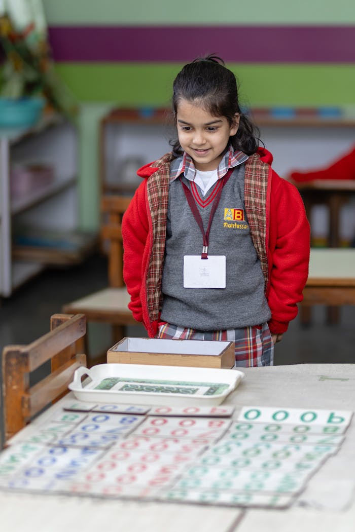 The Art of Drawing Readers In: Your attractive post title goes here A child engaging with Montessori educational materials in a classroom setting.